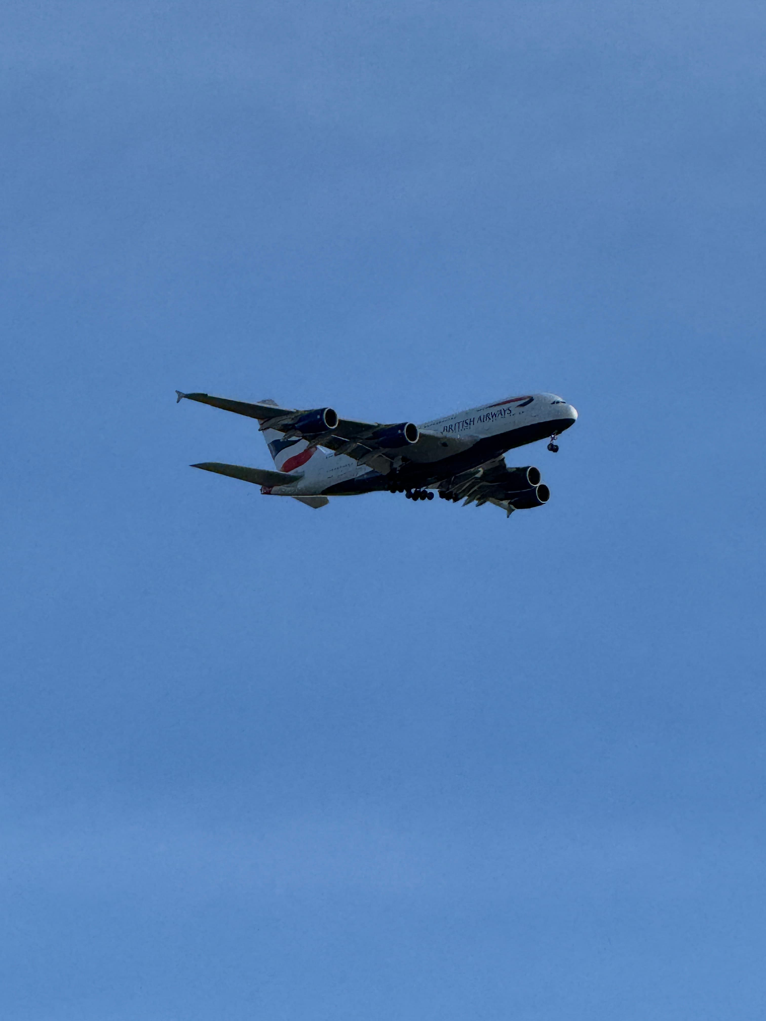British Airways Airbus A380 G-XLEL approaching against a clear blue sky