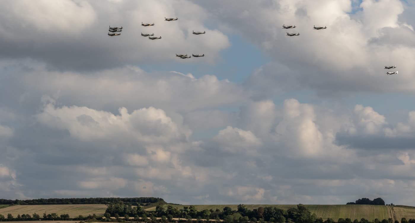 Formation of 17 warbirds over Duxford during a Battle of Britain anniversary air show